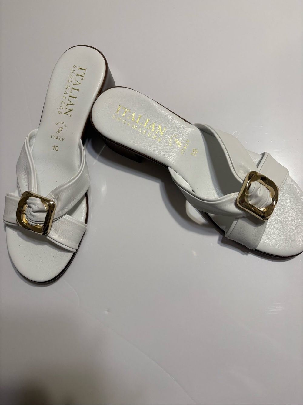 Italian Shoemakers White Slide Mules with Gold Buckle